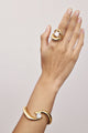 Bracelete Splendore dourado – curvas esculturais com cristal austríaco central – joia statement elegante