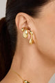 Piercing Memória dourado com design escultural orgânico e curvas fluidas
