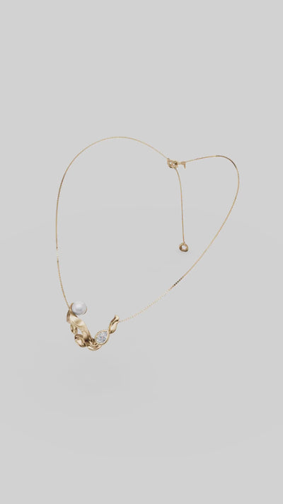 Colar Audrey em dourado, com pingente orgânico, pérola e cristal austríaco. Uma joia clássica e atemporal para produções elegantes e femininas.